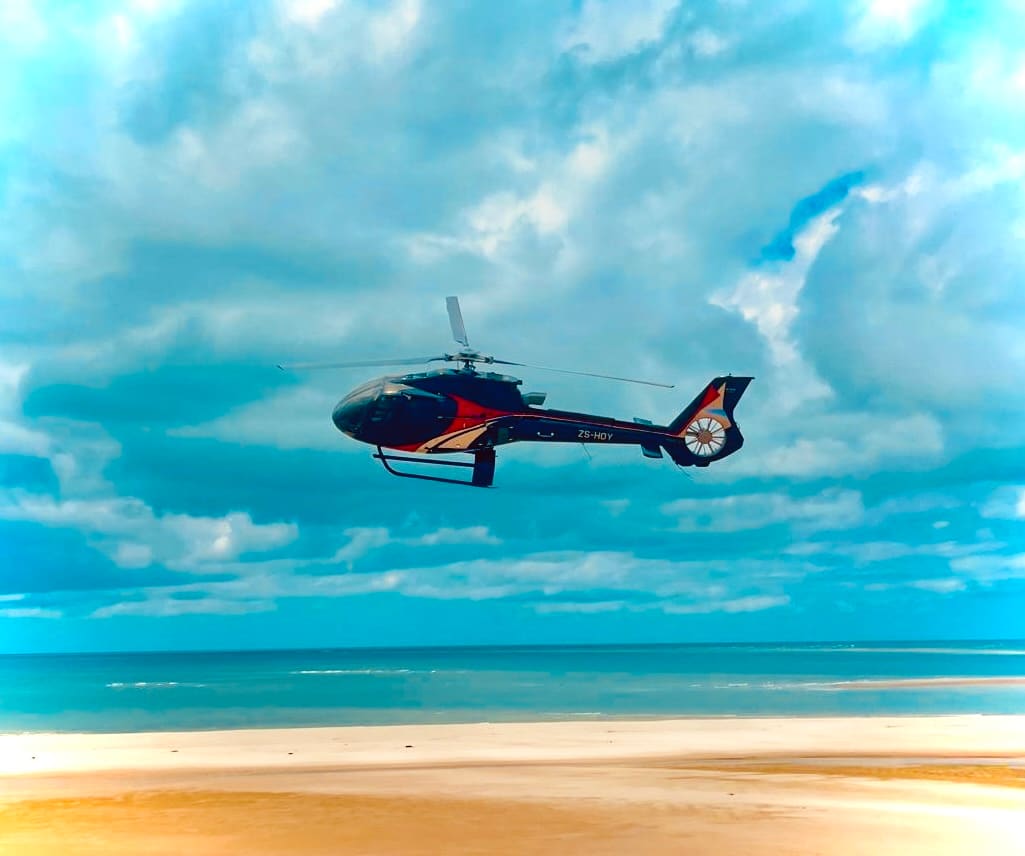 Helicopter flying over an island in the Quirimbas archipelago